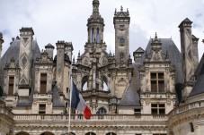 Chambord Castle with the national flag