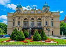 The historic Juliusz Słowacki Theatre with landscaped gardens in Kraków, Poland.