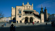 The Cloth Hall building on a clear day in Kraków's Main Market Square.